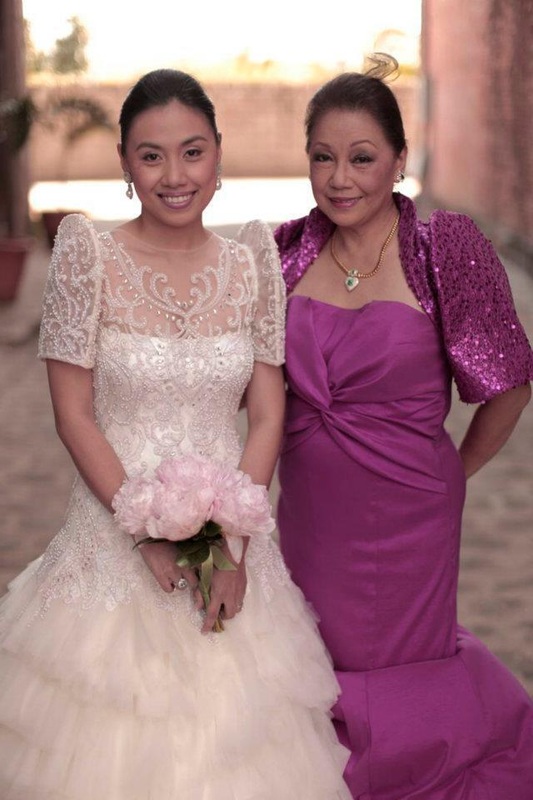 The mother of the bride in a modern sequined terno bolero